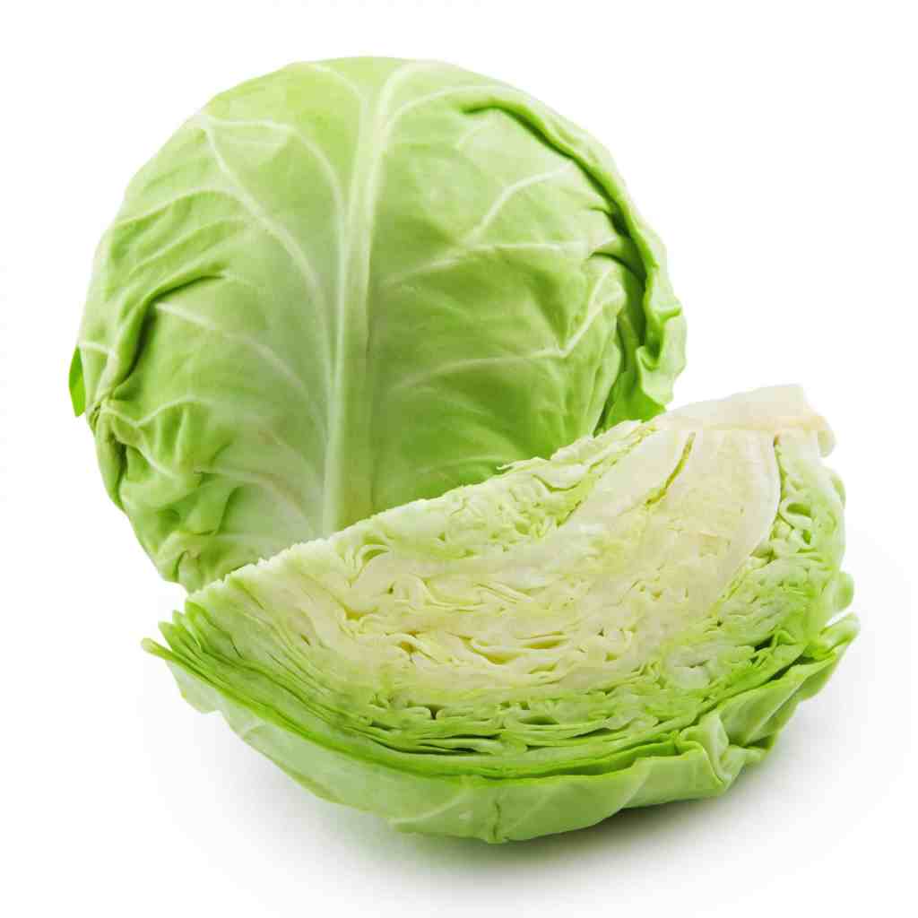 A whole green cabbage next to a cut half, showcasing its layered structure and fresh appearance